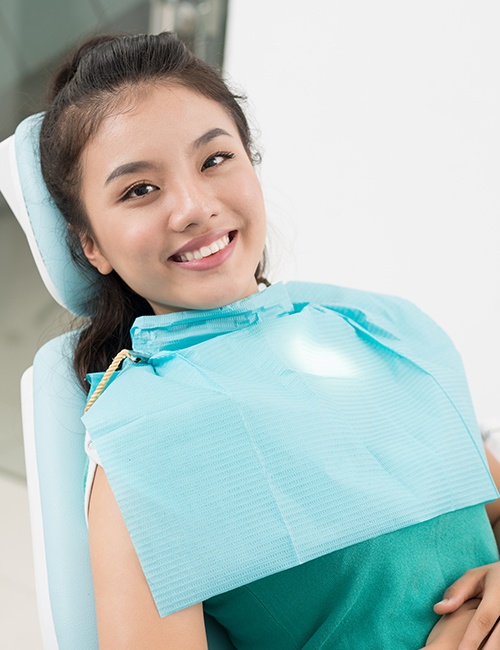 Woman relaxed in dental chair thanks to sedation dentistry